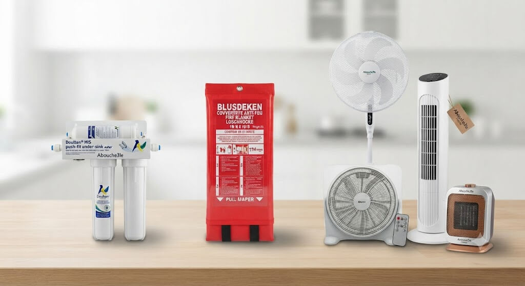 Abou Che3le home appliances collection featuring Doulton water filtration systems, emergency fire blankets, standing fans, tower fans, and space heaters on a wooden surface.