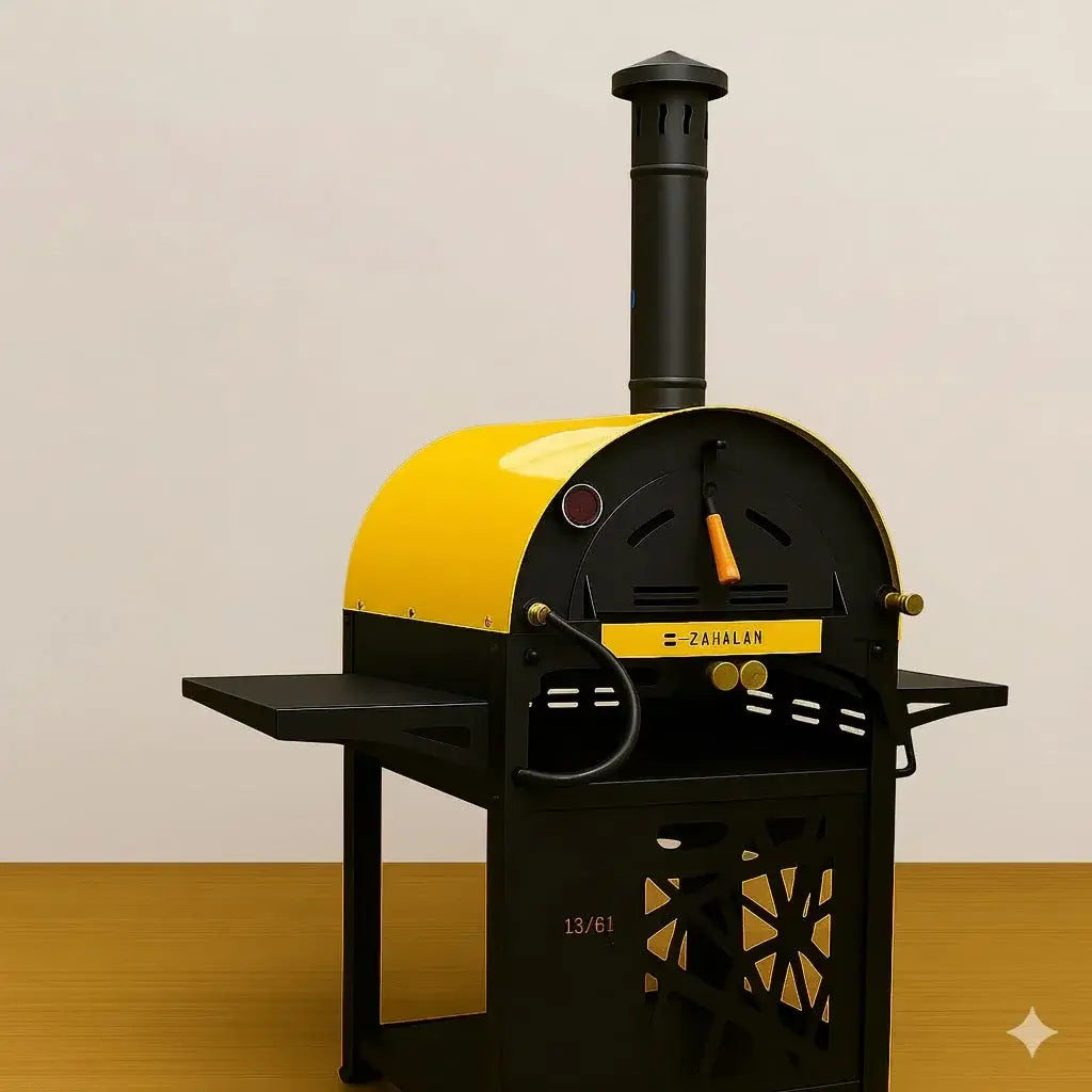 Abou Che3le x Zahalan metal pizza oven in yellow and black with a vertical chimney pipe resting on a wooden surface.