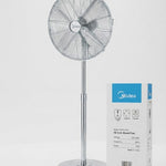 A silver Midea pedestal fan stands next to its white and blue product packaging box on a clean white background. -  Midea 16-inch Stand Fan (FS40-14BU) -  Abouche3le